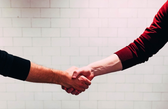 Two people shaking hands