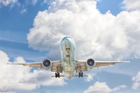 A photo of the underside of a plane in flight